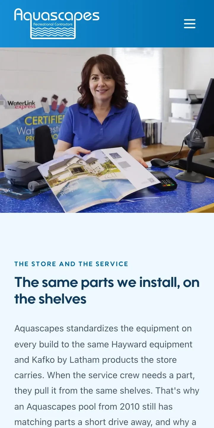The retail store page at phone width: a staff member at the counter with a product catalogue, above The same parts we install, on the shelves heading.